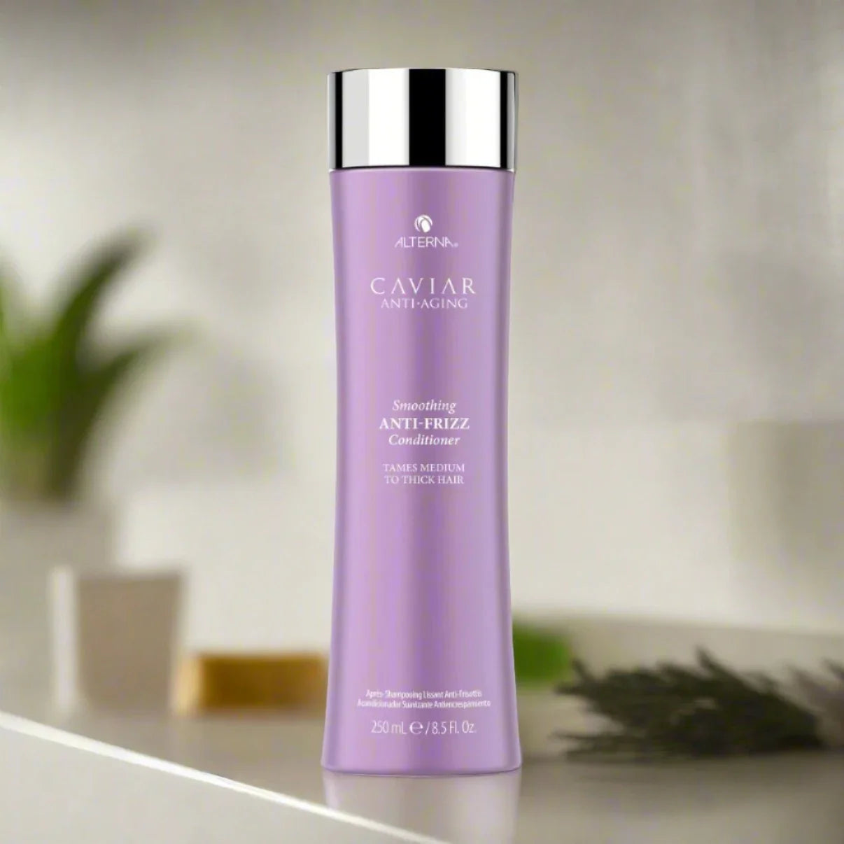 Alterna Anti-Frizz Conditioner 8.5 oz bottle, designed to smooth and tame frizz while providing hydration and enhancing shine for a polished look.