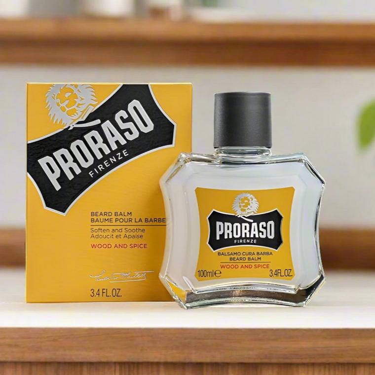 A 100ml jar of Proraso Beard Balm Almond & Cedarwood. The packaging features a classic design with a dark green label and silver accents, showcasing the almond and cedarwood scent. The jar is practical for daily use and highlights the nourishing properties of the balm.