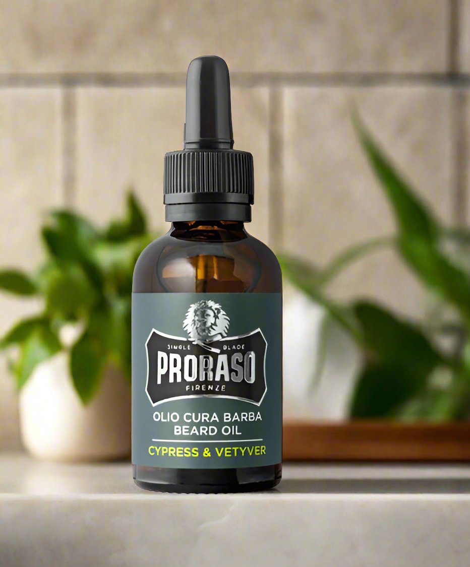 A 30ml bottle of Proraso Beard Oil Cypress & Vetyver. The packaging features a sleek design with a dark green bottle and a refined label, showcasing the sophisticated cypress and vetyver scent. The compact bottle is perfect for daily use and highlights the oil's conditioning and hydrating benefits.