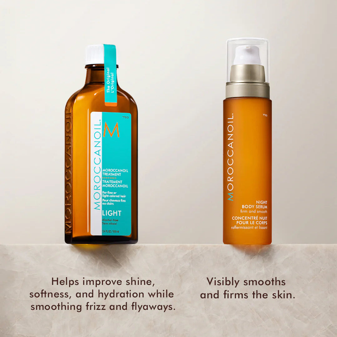 Two bottles of Moroccanoil hair care products on a light background