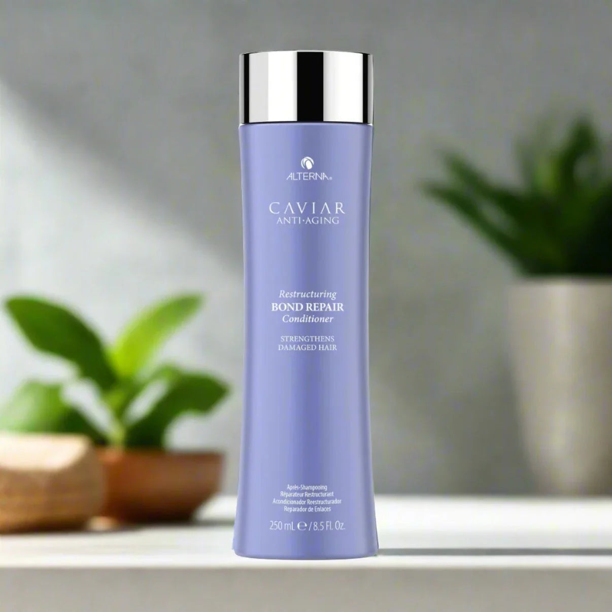 “Alterna Bond Repair Conditioner 8.5 oz bottle, formulated to strengthen and repair damaged hair bonds while providing intense hydration and softness.