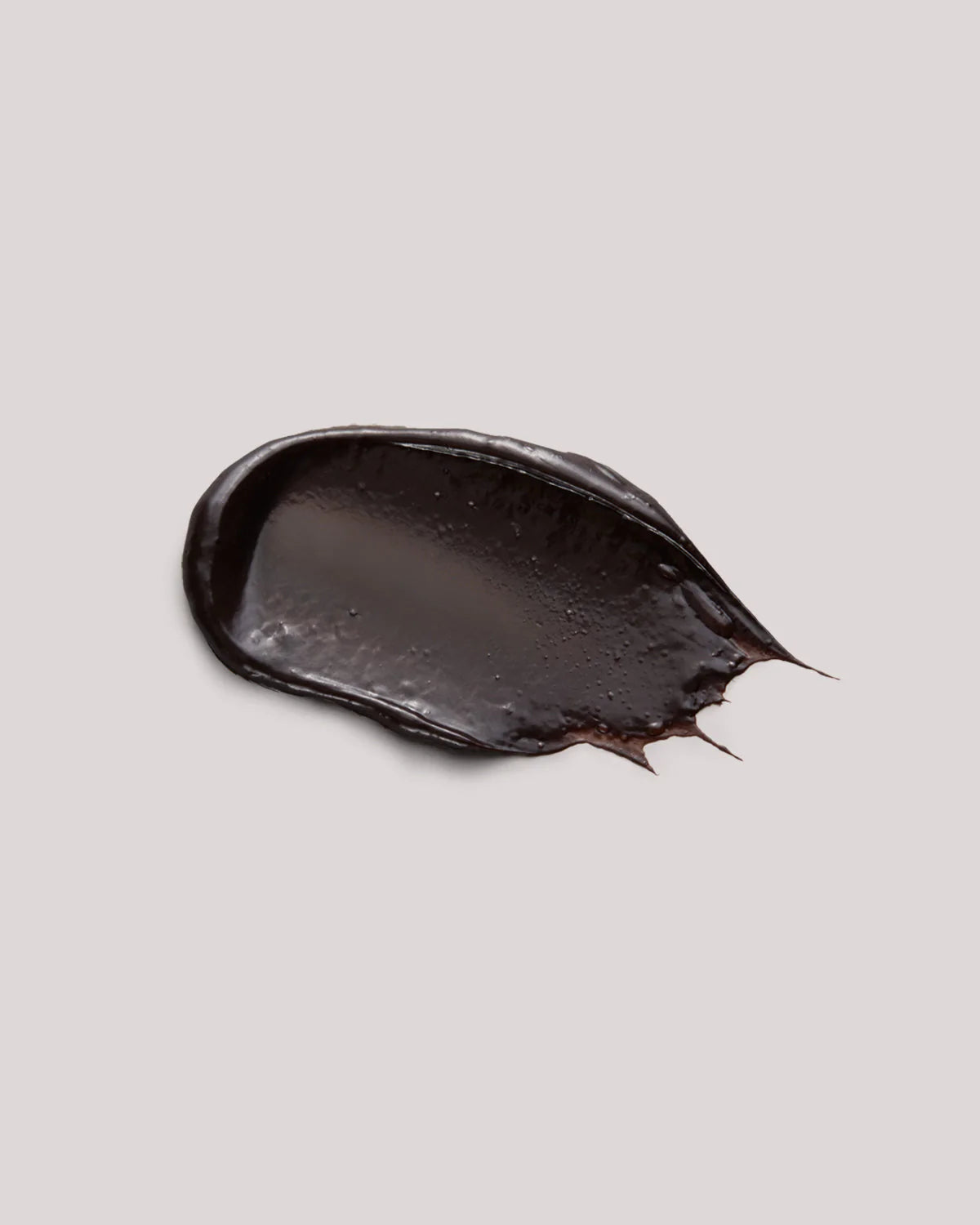 Close up of soft cacao intense cream texture with a smooth, refined appearance.