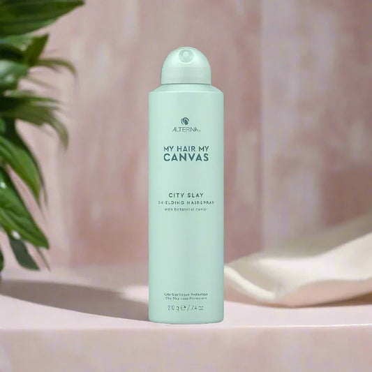 Alterna Caviar My Hair My Canvas City Shielding Hairspray 9 oz can, designed to provide long-lasting hold, protect hair from environmental damage, and add shine.