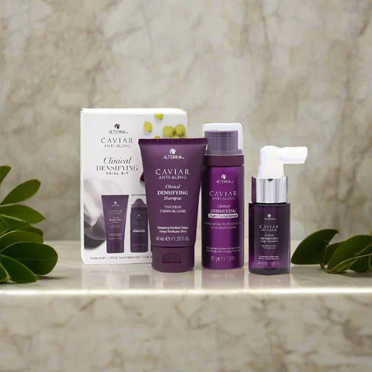 Alterna Caviar Clinical Trial Kit featuring travel-sized bottles of advanced hair care products designed to promote hair health and repair.