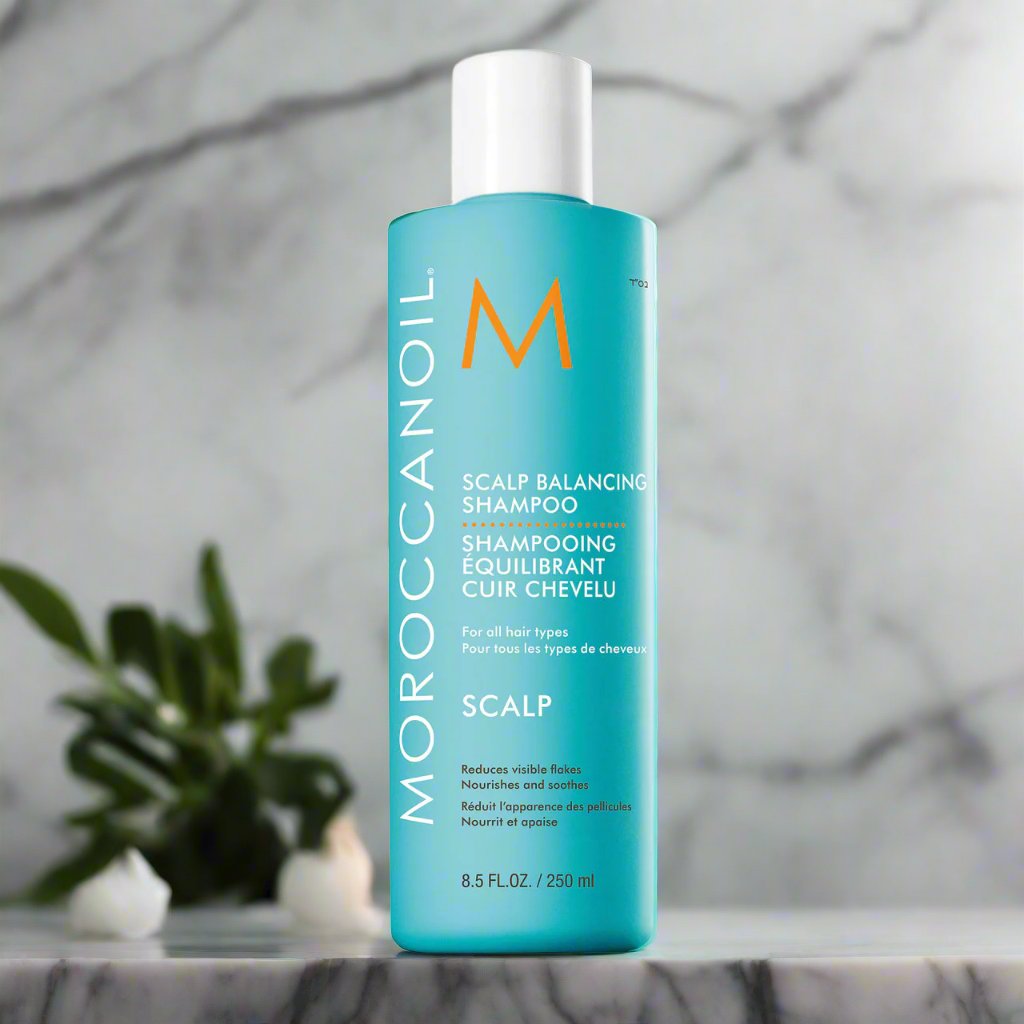 Moroccanoil Scalp Balancing Shampoo 250ml – A soothing shampoo bottle with turquoise labeling and signature branding.