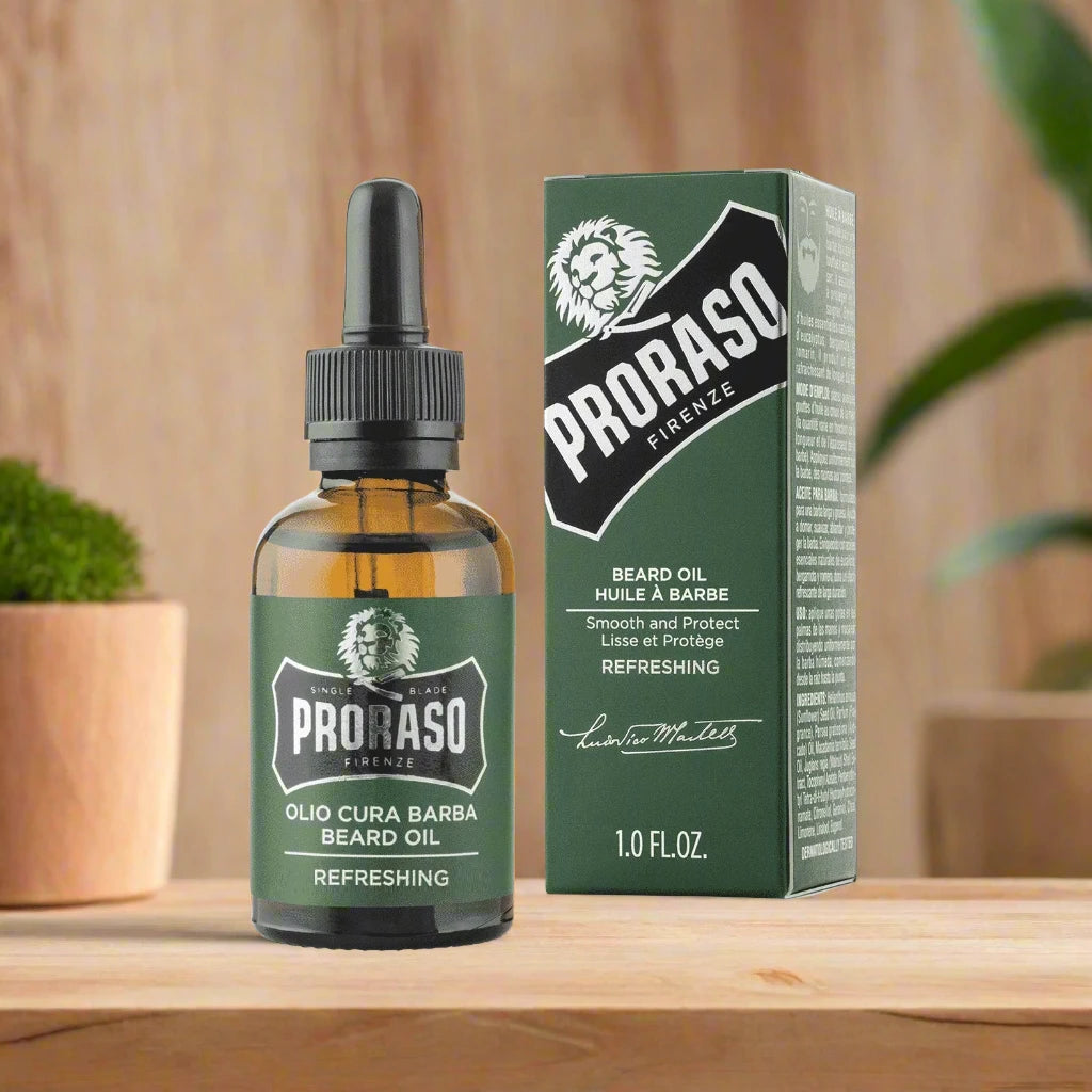 A 30ml bottle of Proraso Beard Oil Refreshing. The packaging features a clean design with a bright blue bottle and a clear label, emphasizing the refreshing and invigorating scent. The compact size is ideal for everyday use and highlights the oil's conditioning and hydrating properties.