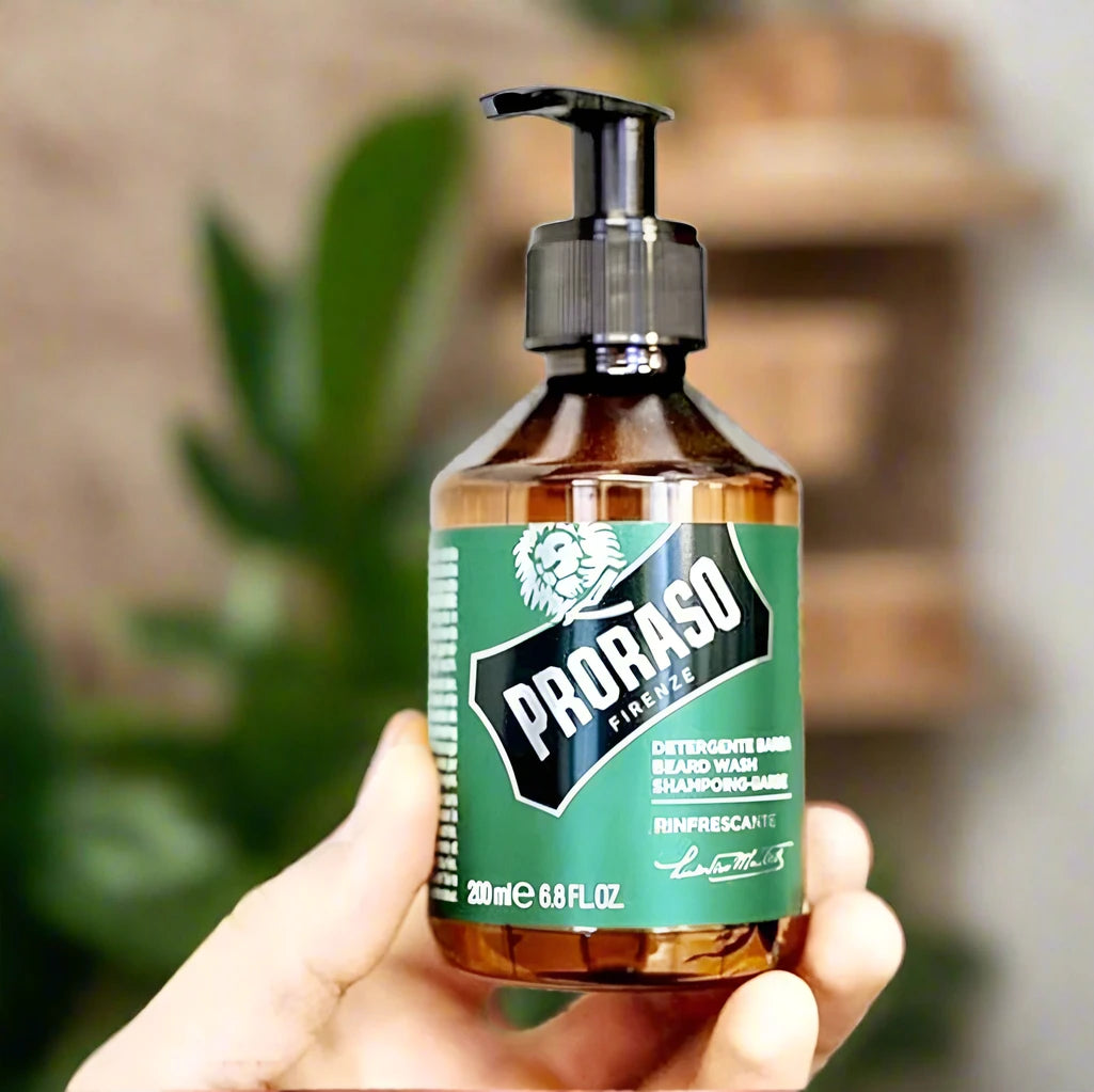 A 200ml bottle of Proraso Beard Shampoo Refreshing. The packaging features a clean, bright design with a light blue bottle and a clear label, emphasizing the refreshing and energizing scent. The bottle is designed for convenient use and highlights the shampoo’s cleansing and revitalizing properties.