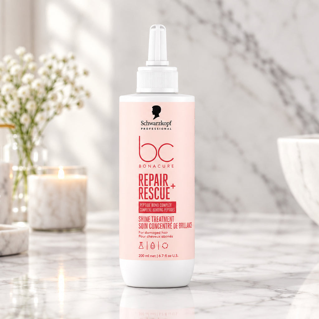 A bottle of Schwarzkopf Professional BC Repair Rescue hair treatment, featuring a white bottle with pink and black text, set against a split pink and white background.