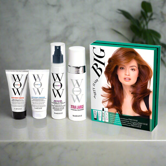 Hair care product set with 'WOW' branding and a box featuring a woman's face.