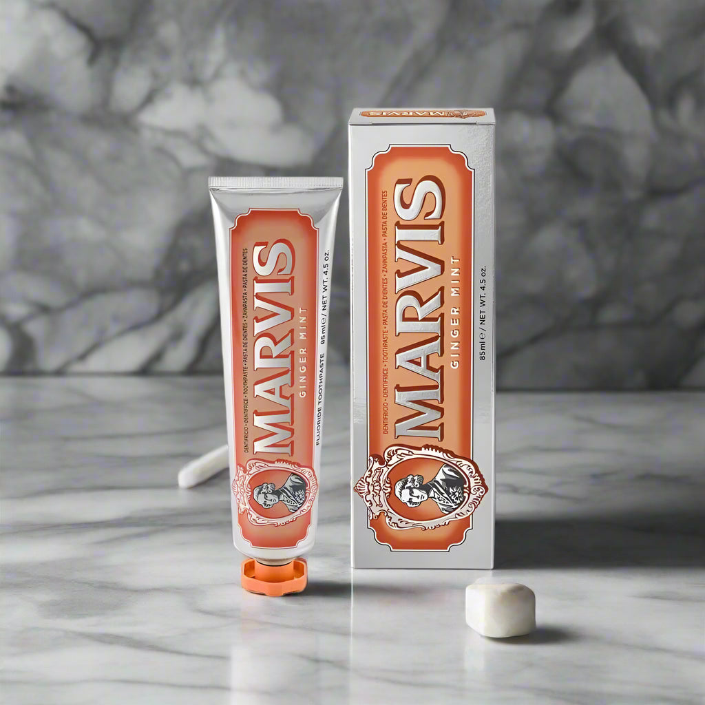 Marvis ginger mint toothpaste tube and packaging on a white background
