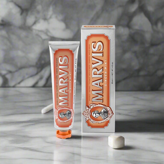 Marvis ginger mint toothpaste tube and packaging on a white background