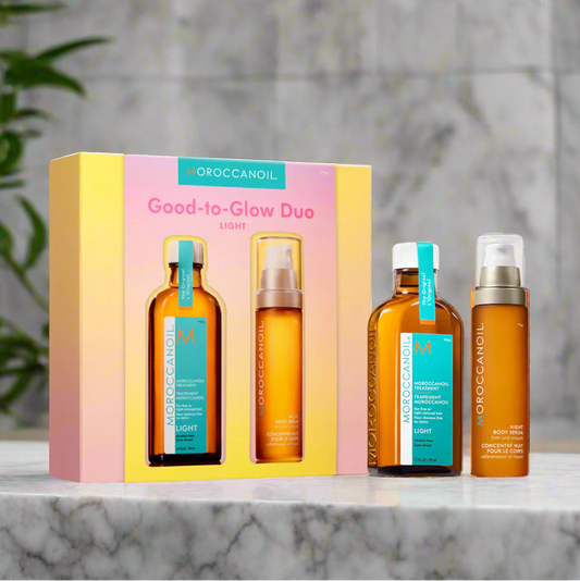 MOROCCANOIL Good-to-Glow Duo set with bottles and packaging on a light background