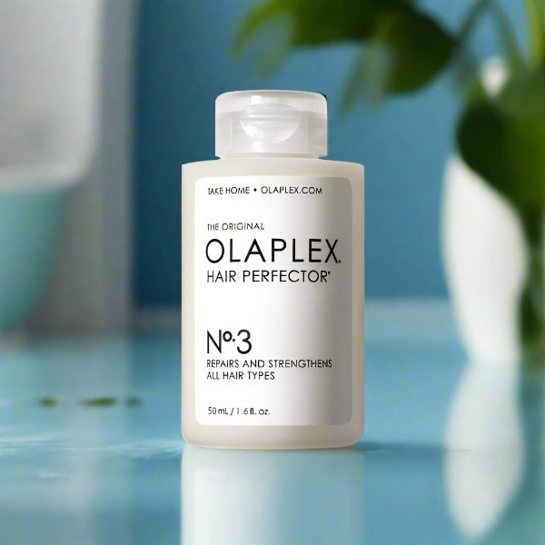olaplex no 3 bottle 50ml in blue bathroom background